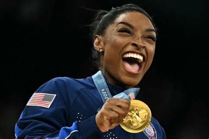 The Woman Behind The Olympic Gold Medalist
